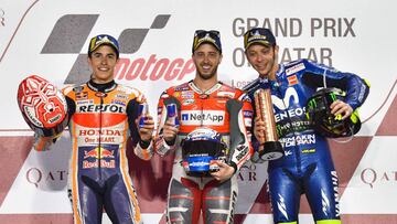 The champion Italian MotoGP rider Andrea Dovizioso (C) of Ducati, third placed Italian MotoGP rider Valentino Rossi (R) of Movistar Yamaha and Second placed Spanish MotoGP rider Marc Marquez (L) of Repsol Honda Team celebrate on the podium after the 2018 MotoGP Grand Prix of Qatar at the Losail International Circuit in Doha, capital of Qatar, on March 18, 2018.Andrea Dovizioso claimed the title with a time 42 minutes and 34.654 seconds (Xinhua/Nikku)