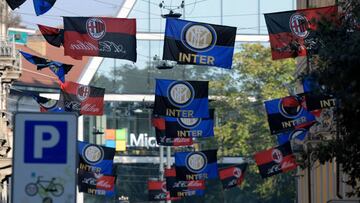 Flags of Italian football clubs Inter Milan and AC Milan are hanged in the Paolo Sarpi street, a chinese neighborhood of Milan, on October 13, 2017. Milan&#039;s derby on October 15, 2017 takes on even more significance as both teams are now under Chinese