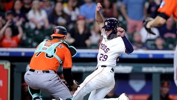 Aug 16, 2025; Houston, Texas, USA; Baltimore Orioles catcher Alex Jackson (70) tags out Houston Astros second baseman Ramon Urias (29) at home plate during the 11th inning at Daikin Park. Mandatory Credit: Erik Williams-Imagn Images