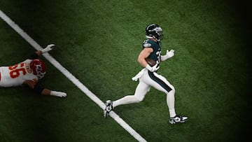 Philadelphia Eagles' defensive back #33 Cooper DeJean runs an interception to score a touchdown during Super Bowl LIX between the Kansas City Chiefs and the Philadelphia Eagles at Caesars Superdome in New Orleans, Louisiana, February 9, 2025. (Photo by Chandan Khanna / AFP)