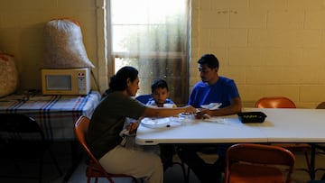 An asylum-seeking family from Nicaragua is pictured eating dinner at El Calvario United Methodist Church, which is being used as a shelter for migrants in Las Cruces, New Mexico, U.S., September 21, 2022. REUTERS/Paul Ratje