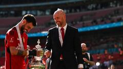 Manchester United's Dutch manager Erik ten Hag (R) and Manchester United's Portuguese midfielder #08 Bruno Fernandes hold the trophy as they celebrate their victory at the end of the English FA Cup final football match between Manchester City and Manchester United at Wembley stadium, in London, on May 25, 2024. Manchester United wins 2 - 1 against Manchester City. (Photo by Ben Stansall / AFP) / NOT FOR MARKETING OR ADVERTISING USE / RESTRICTED TO EDITORIAL USE