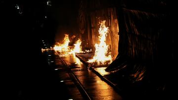 A fire is seen next to a fence in front of the National Palace as demonstrators march to demand justice in the 2014 disappearance of 43 student teachers from the Ayotzinapa Rural Teachers' College, in Mexico City, Mexico September 26, 2024. REUTERS/Henry Romero