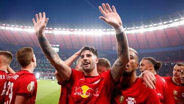 Leipzig's Hungarian midfielder Dominik Szoboszlai (C) celebrates with teammates after scoring the 2-0 goal during the German Cup (DFB Pokal) final football match RB Leipzig v Eintracht Frankfurt in Berlin, Germany, on June 3, 2023. (Photo by Odd ANDERSEN / AFP) / DFB REGULATIONS PROHIBIT ANY USE OF PHOTOGRAPHS AS IMAGE SEQUENCES AND QUASI-VIDEO.