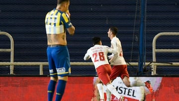 Brazil's Red Bull Bragantino Bruno Praxedes (R) celebrates with a teammate after scoring against Argentina's Rosario Central during the Copa Sudamericana quarter-finals first leg football match at the Gigante de Arroyito Stadium in Rosario, Arge