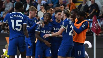 Chelsea's English midfielder #07 Raheem Sterling (3L) is mobbed by teammates after scoring the team's third goal during the English Premier League football match between Burnley and Chelsea at Turf Moor in Burnley, north-west England on October 7, 2023. (Photo by Oli SCARFF / AFP) / RESTRICTED TO EDITORIAL USE. No use with unauthorized audio, video, data, fixture lists, club/league logos or 'live' services. Online in-match use limited to 120 images. An additional 40 images may be used in extra time. No video emulation. Social media in-match use limited to 120 images. An additional 40 images may be used in extra time. No use in betting publications, games or single club/league/player publications. /