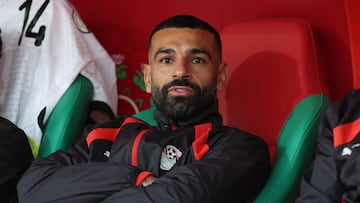 Egypt's forward #10 Mohamed Salah looks on from the substitutes bench during the Africa Cup of Nations (CAN) Group B football match between Angola and Egypt at Adrar Stadium in Agadir on December 29, 2025. (Photo by FRANCK FIFE / AFP)