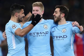 Sergio Aguero celebrates his team's third goal with team mates Kevin de Bruyne and Bernardo Silva.