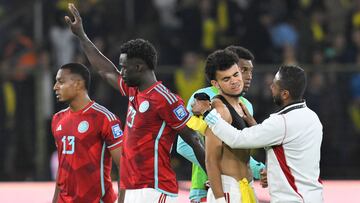 Colombia's defenders Willer Ditta (L) and Davinson Sanchez (2-L) and forward Luis Diaz (2-R) leave the field at the end of the 2026 FIFA World Cup South American qualification football match between Ecuador and Colombia at the Rodrigo Paz Delgado Stadium in Quito, on October 17, 2023. (Photo by Rodrigo BUENDIA / AFP)