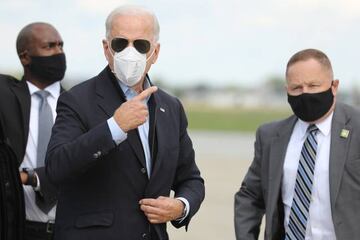 Democratic presidential nominee and former Vice President Joe Biden speaks briefly with journalists before traveling to Grand Rapids, Michigan, at New Castle County Airport October 2, 2020 in New Castle, Delaware. Biden said he tested negative twice Frida