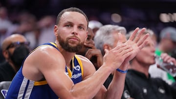 Apr 16, 2024; Sacramento, California, USA; Golden State Warriors guard Stephen Curry (30) sits on the bench during action against the Sacramento Kings in the fourth quarter during a play-in game of the 2024 NBA playoffs at the Golden 1 Center. Mandatory Credit: Cary Edmondson-USA TODAY Sports