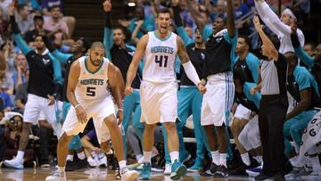CHAPEL HILL, NC - SEPTEMBER 28: Willy Hernangomez #41 of the Charlotte Hornets reacts on the bench after Nicolas Batum #5 of the Charlotte Hornets hits a three-point basket against the Boston Celtics in the third quarter during a preseason game at Dean Sm