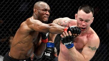 Kamaru Usman golpea a Colby Covington durante el UFC 245.