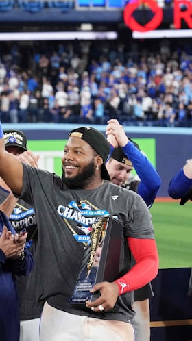 TORONTO, ONTARIO - OCTOBER 20: Vladimir Guerrero Jr. #27 of the Toronto Blue Jays celebrates with team president and CEO Mark Shapiro after winning game seven of the American League Championship Series against the Seattle Mariners at the Rogers Centre on October 20, 2025 in Toronto, Ontario. Mark Blinch/Getty Images/AFP (Photo by MARK BLINCH / GETTY IMAGES NORTH AMERICA / Getty Images via AFP)