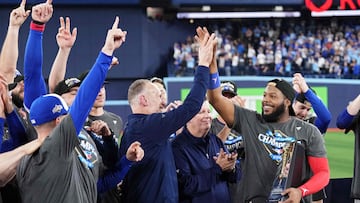 TORONTO, ONTARIO - OCTOBER 20: Vladimir Guerrero Jr. #27 of the Toronto Blue Jays celebrates with team president and CEO Mark Shapiro after winning game seven of the American League Championship Series against the Seattle Mariners at the Rogers Centre on October 20, 2025 in Toronto, Ontario. Mark Blinch/Getty Images/AFP (Photo by MARK BLINCH / GETTY IMAGES NORTH AMERICA / Getty Images via AFP)
