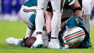 MIAMI GARDENS, FLORIDA - SEPTEMBER 12: Tua Tagovailoa #1 of the Miami Dolphins lays on the ground after colliding with Damar Hamlin #3 of the Buffalo Bills during the third quarter in the game at Hard Rock Stadium on September 12, 2024 in Miami Gardens, Florida. Carmen Mandato/Getty Images/AFP (Photo by Carmen Mandato / GETTY IMAGES NORTH AMERICA / Getty Images via AFP)