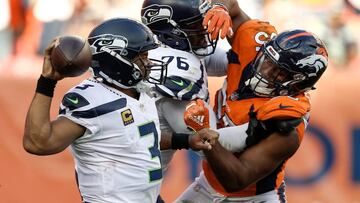 Sep 9, 2018; Denver, CO, USA; Seattle Seahawks quarterback Russell Wilson (3) looks to pass as offensive tackle Duane Brown (76) blocks against Denver Broncos outside linebacker Bradley Chubb (55) in the fourth quarter at Broncos Stadium at Mile High. Mandatory Credit: Isaiah J. Downing-USA TODAY Sports