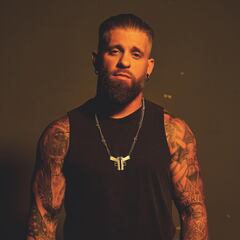 Country music star Brantley Gilbert smashes Bud Light can tossed to him during concert