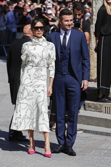 La diseñadora de moda Victoria Beckham con su marido el exfutbolista del Real Madrid David Beckham.
