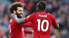 LIVERPOOL, ENGLAND - DECEMBER 14: Mohamed Salah of Liverpool celebrates his sides first goal with Sadio Mane during the Premier League match between Liverpool FC and Watford FC at Anfield on December 14, 2019 in Liverpool, United Kingdom. (Photo by Clive 