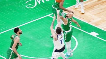 Jun 17, 2024; Boston, Massachusetts, USA; Dallas Mavericks guard Luka Doncic (77) shoots against Boston Celtics guard Derrick White (9) in the third quarter during game five of the 2024 NBA Finals at TD Garden. Mandatory Credit: David Butler II-USA TODAY Sports
