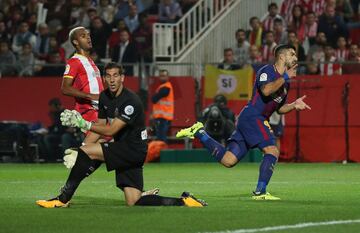 Suárez wheels away in celebration after scoring Barcelona's third goal.