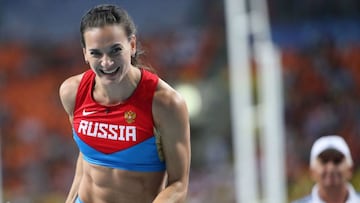 Russia&#039;s Yelena Isinbayeva celebrates after clearing the bar during the women&#039;s pole vault final at the 2013 IAAF World Championships at the Luzhniki stadium in Moscow on August 13, 2013. Isinbayeva won the gold medal. AFP PHOTO / FRANCK FIFE