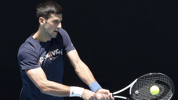 MELBOURNE, AUSTRALIA - JANUARY 12: Novak Djokovic of Serbia plays a backhand shot during a practice session ahead of the 2022 Australian Open at Melbourne Park on January 12, 2022 in Melbourne, Australia. (Photo by Darrian Traynor/Getty Images)