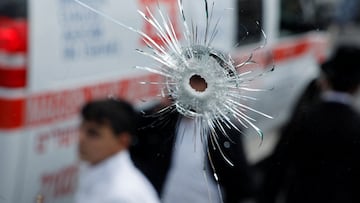 A bullet hole on a bus is seen at the scene where a suspected shooting attack took place at the outskirts of Jerusalem, September 8, 2025 REUTERS/Ammar Awad