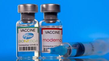 FILE PHOTO: Vials with Pfizer-BioNTech and Moderna coronavirus disease (COVID-19) vaccine labels are seen in this illustration picture taken March 19, 2021. REUTERS/Dado Ruvic/Illustration/File Photo