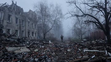 Ukrainian serviceman walks near apartment buildings damaged by Russian military strike, amid Russia's attack on Ukraine, in the frontline town of Kostiantynivka in Donetsk region, Ukraine November 28, 2025. Oleg Petrasiuk/Press Service of the 24th King Danylo Separate Mechanized Brigade of the Ukrainian Armed Forces/Handout via REUTERS ATTENTION EDITORS - THIS IMAGE HAS BEEN SUPPLIED BY A THIRD PARTY.