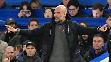 Manchester City's Spanish manager Pep Guardiola gestures on the touchline during the English Premier League football match between Chelsea and Manchester City at Stamford Bridge in London on November 12, 2023. (Photo by Glyn KIRK / IKIMAGES / AFP) / RESTRICTED TO EDITORIAL USE. No use with unauthorized audio, video, data, fixture lists, club/league logos or 'live' services. Online in-match use limited to 45 images, no video emulation. No use in betting, games or single club/league/player publications.