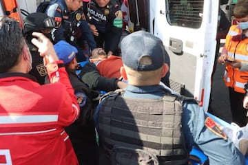 An injured man is taken out the Indios Verdes metro station after two trains collided in Mexico City on January 7, 2023. - At least one person died and 10 injured left this Saturday a collision between two trains of the Mexico City Metro, a megacity of about 20 million inhabitants, local authorities reported. (Photo by AFP) (Photo by STR/AFP via Getty Images)