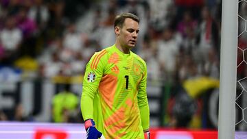 Germany's goalkeeper #01 Manuel Neuer reacts after conceding the 1-0 goal during the UEFA Euro 2024 Group A football match between Switzerland and Germany at the Frankfurt Arena in Frankfurt am Main on June 23, 2024. (Photo by Tobias SCHWARZ / AFP)