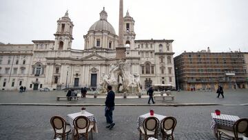 Empty tables are pictured in Piazza Navona as the government is due to announce stricter coronavirus disease (COVID-19) restrictions, in Rome, Italy, March 12, 2021. REUTERS/Yara Nardi