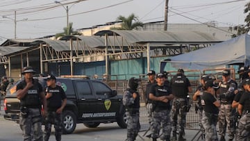 Police stand guard outside the Guayas 1 prison complex in Guayaquil, Ecuador on October 5, 2022. - The Ecuadorian police intervened Wednesday in a prison of Guayaquil (southwest of Ecuador) following new "incidents" between inmates, two days after the massacre of 16 prisoners in another prison in the country, according to the authorities. (Photo by Gerardo MENOSCAL / AFP) (Photo by GERARDO MENOSCAL/AFP via Getty Images)