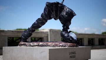The statue of Argentina's soccer player Lionel Messi is seen covered after it was vandalized in Buenos Aires, Argentina