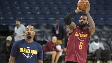 May 30, 2018; Oakland, CA, USA; Cleveland Cavaliers forward LeBron James (right) shoots the basketball next to guard JR Smith (left) during NBA Finals media day at Oracle Arena. Mandatory Credit: Kyle Terada-USA TODAY Sports