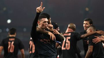 LONDON, ENGLAND - DECEMBER 22: Phil Foden of Manchester City celebrates after scoring their sides third goal with teammate Joao Cancelo during the Carabao Cup Quarter Final match between Arsenal and Manchester City at Emirates Stadium on December 22, 2020