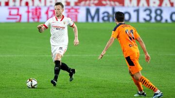 Ivan Rakitic of Sevilla and Ruben Sobrino of Valencia during 1/8 round of Copa del Rey, football match played between Sevilla Futbol Club and Valencia Club de Futbol at Ramon Sanchez Pizjuan Stadium on January 27, 2021 in Sevilla, Spain.
 AFP7 
 27/01/202