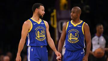 LOS ANGELES, CALIFORNIA - OCTOBER 13: Stephen Curry #30 and Chris Paul #3 of the Golden State Warriors talk after a stop in play against the Los Angeles Lakers during the first half in a preseason game at Crypto.com Arena on October 13, 2023 in Los Angeles, California.   Harry How/Getty Images/AFP NOTE TO USER: User expressly acknowledges and agrees that, by downloading and/or using this photograph, user is consenting to the terms and conditions of the Getty Images License Agreement. (Photo by Harry How / GETTY IMAGES NORTH AMERICA / Getty Images via AFP)