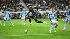 Mar 9, 2024; Los Angeles, California, USA; LAFC defender Omar Campos (2) jumps to retrieve a loose ball against Sporting Kansas City midfielder Jake Davis (17) during the first half at BMO Stadium. Mandatory Credit: Kelvin Kuo-USA TODAY Sports