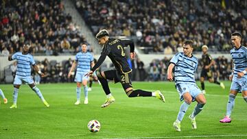 Mar 9, 2024; Los Angeles, California, USA; LAFC defender Omar Campos (2) jumps to retrieve a loose ball against Sporting Kansas City midfielder Jake Davis (17) during the first half at BMO Stadium. Mandatory Credit: Kelvin Kuo-USA TODAY Sports