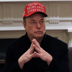 FILE PHOTO: Tesla CEO Elon Musk wears a 'Trump Was Right About Everything!' hat while attending a cabinet meeting at the White House, in Washington, D.C., U.S., March 24, 2025. REUTERS/Carlos Barria/File Photo