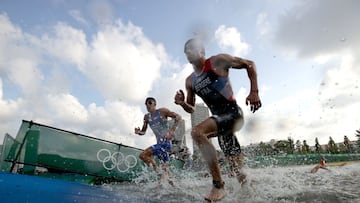 TOKYO, JAPAN - JULY 26: Gianluca Pozzatti of Team Italy and Leo Bergere of Team France leave the water during the Men&#039;s Individual Triathlon on day three of the Tokyo 2020 Olympic Games at Odaiba Marine Park on July 26, 2021 in Tokyo, Japan. (Photo by Adam Pretty/Getty Images)