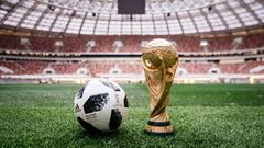 A handout picture taken on September 15, 2017 and provided by Adidas shows the official match ball for the 2018 World Cup football tournament, named &quot;Telstar 18&quot;, on the field of the Luzhniki stadium in Moscow. / AFP PHOTO / Adidas / Arsen GALST