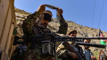 Afghan resistance movement and anti-Taliban uprising forces patrol along a road at the Rah-e Tang in Panjshir province on August 25, 2021 following Taliban&#039;s military takeover of Afghanistan. (Photo by Ahmad SAHEL ARMAN / AFP)