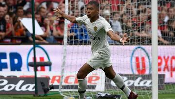 Paris Saint-Germain&#039;s French forward Kylian Mbappe celebrates after scoring their second goal during the French L1 football match between Guingamp and Paris Saint-Germain, at the Roudourou stadium in Guingamp on August 18, 2018. (Photo by FRED TANNEA