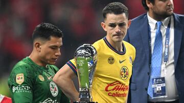 America's Spanish midfielder #08 Alvaro Fidalgo reacts in front of the trophy during a ceremony for the Mexican Champions following the Liga MX Clausura football tournament second leg final between Toluca and America at the Nemesio Diez stadium in Toluca de Lerdo, state of Mexico, Mexico on May 25, 2025. (Photo by CARL DE SOUZA / AFP)