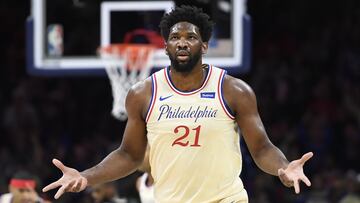 (FILES) In this file photo taken on December 25, 2019, Joel Embiid of the Philadelphia 76ers reacts after scoring during the first half of the game against the Milwaukee Bucks in Philadelphia, Pennsylvania. NOTE TO USER: User expressly acknowledges and agrees that, by downloading and or using this photograph, User is consenting to the terms and conditions of the Getty Images License Agreement. Sarah Stier/Getty Images/AFP - Embiid returned to full workouts on January 24, 2020, with the NBA club and will be re-evaluated Monday, three weeks after undergoing surgery for a torn left ringfinger ligament. The 25-year-old Cameroonian 7-footer will miss Saturday's home game against the Los Angeles Lakers but after the evaluation, a team decision announced on the NBA website, he could be back on the court Tuesday when the 76ers face Golden State. (Photo by Sarah Stier / GETTY IMAGES NORTH AMERICA / AFP)